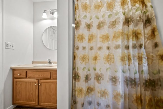bathroom with vanity and a shower with shower curtain