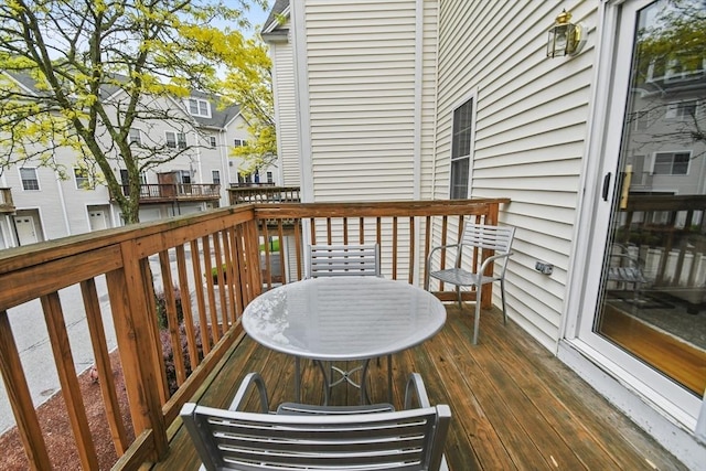 wooden terrace with a residential view