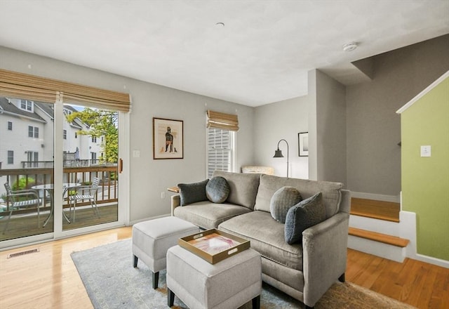 living room featuring wood finished floors and baseboards
