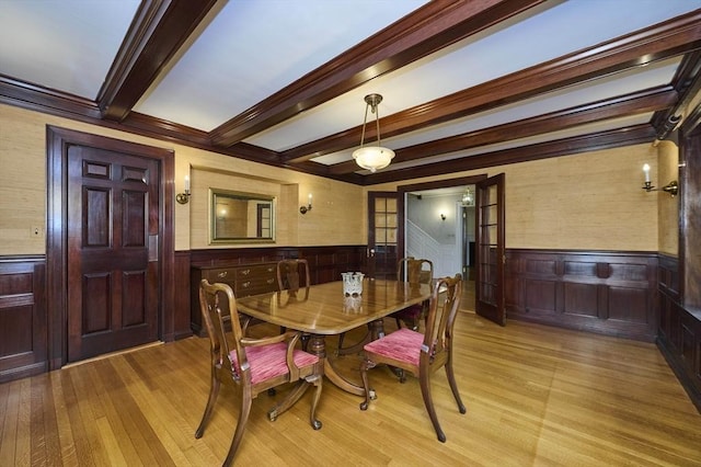 92 Dean Rd, Brookline, MA 02445 - dining area with a wainscoted wall, beam ceiling, light wood-style floors, and wooden walls