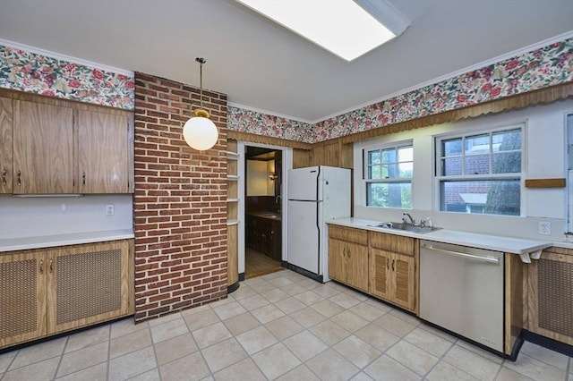 92 Dean Rd, Brookline, MA 02445 - kitchen with dishwasher, freestanding refrigerator, light countertops, a sink, and crown molding