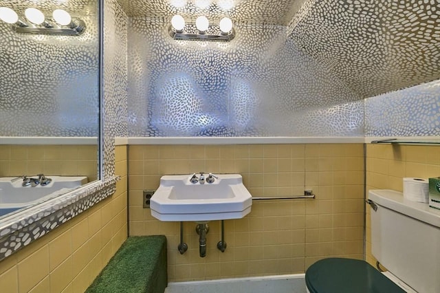 92 Dean Rd, Brookline, MA 02445 - bathroom featuring a sink, toilet, and tile walls