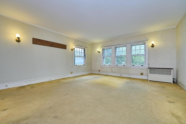 92 Dean Rd, Brookline, MA 02445 - carpeted empty room featuring radiator heating unit, ornamental molding, and baseboards