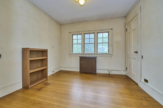 92 Dean Rd, Brookline, MA 02445 - unfurnished room featuring radiator heating unit and wood finished floors