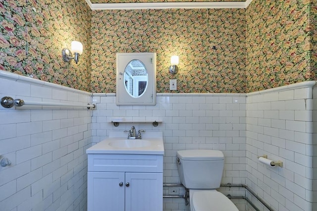 92 Dean Rd, Brookline, MA 02445 - half bath featuring wallpapered walls, wainscoting, vanity, toilet, and tile walls