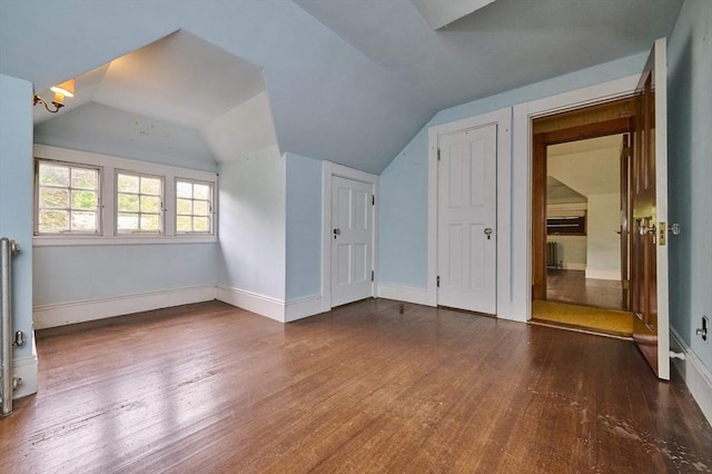 92 Dean Rd, Brookline, MA 02445 - additional living space with hardwood / wood-style floors, lofted ceiling, and baseboards