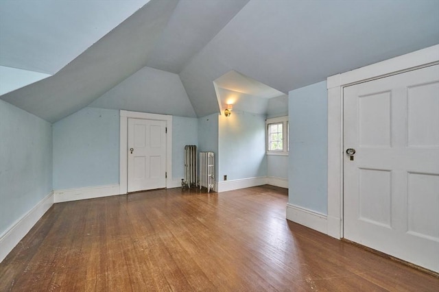 92 Dean Rd, Brookline, MA 02445 - bonus room with wood finished floors, vaulted ceiling, and baseboards