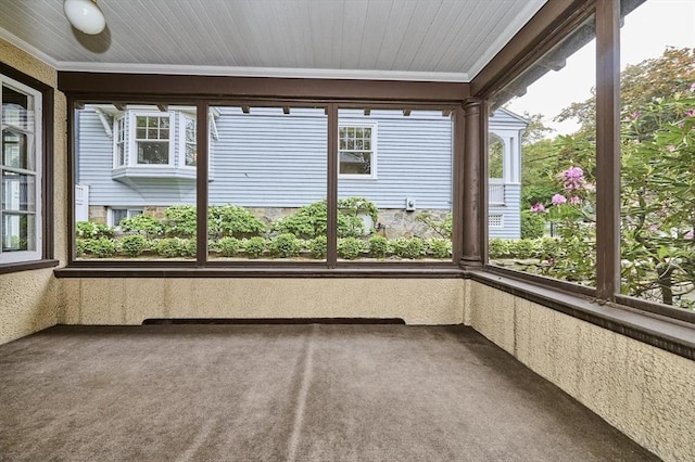 92 Dean Rd, Brookline, MA 02445 - unfurnished sunroom featuring carpet and crown molding