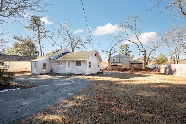 back of house with a yard