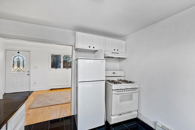 kitchen with white cabinetry, dark tile patterned flooring, white appliances, and a baseboard heating unit