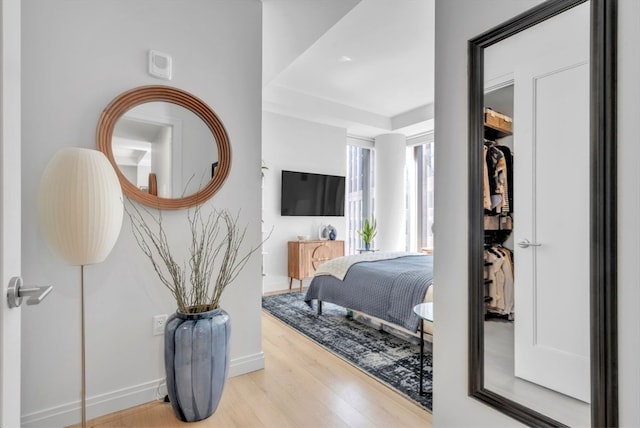 bedroom with a closet and light wood-type flooring