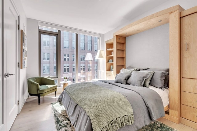 bedroom with light wood-type flooring