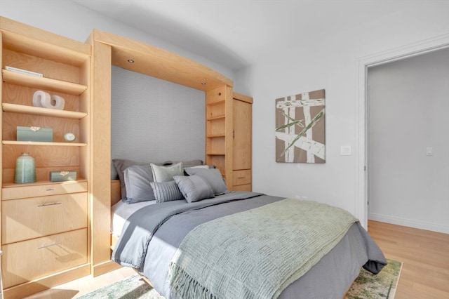 bedroom featuring light wood-type flooring