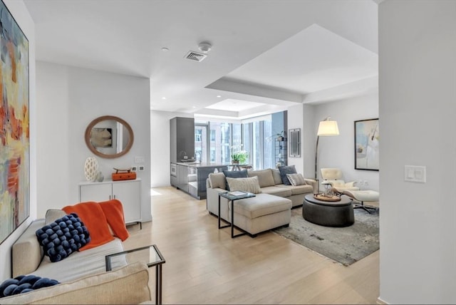 living room with light hardwood / wood-style flooring