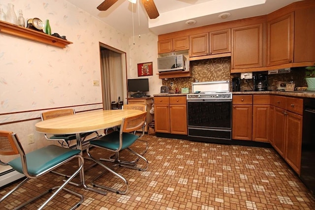 kitchen with ceiling fan, black dishwasher, range, and backsplash