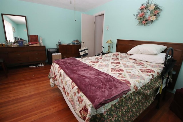 bedroom featuring dark wood-type flooring