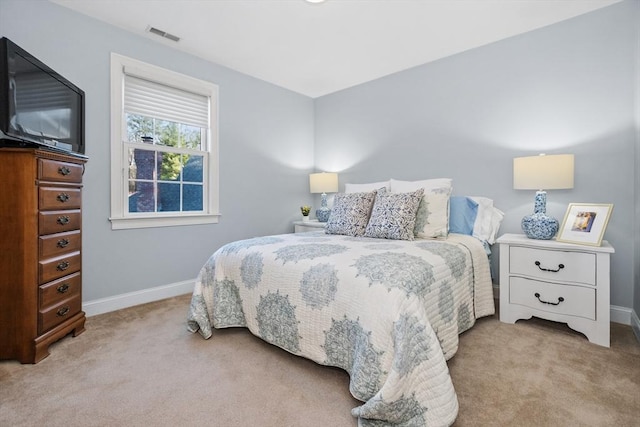 bedroom with visible vents, baseboards, and carpet floors