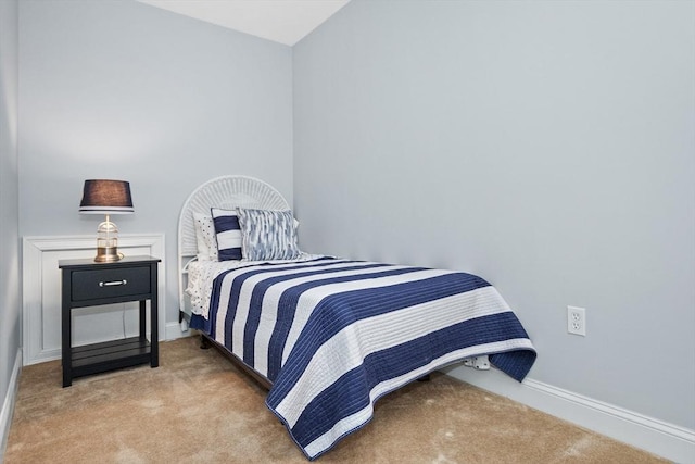 carpeted bedroom with baseboards