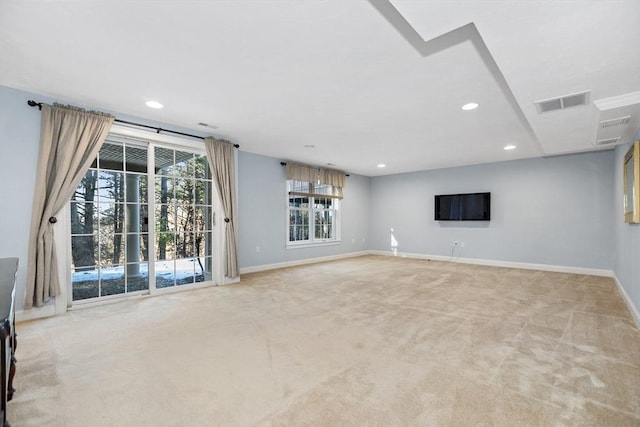 unfurnished living room with recessed lighting, visible vents, baseboards, and carpet flooring