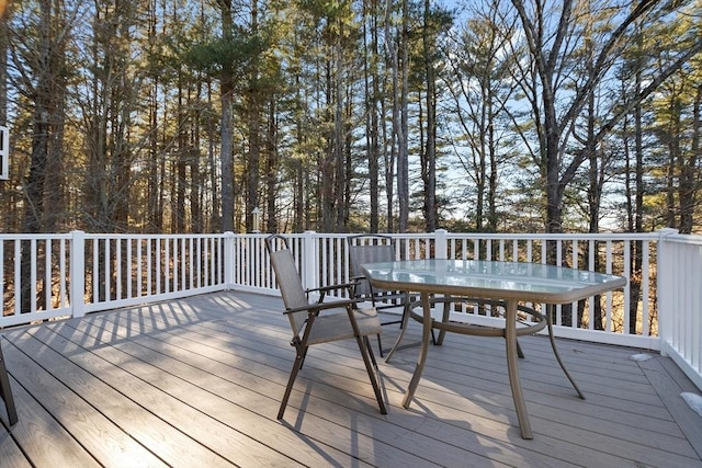 wooden deck featuring outdoor dining space