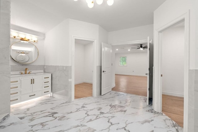 57 Mayflower Rd, Needham, MA 02492 - bathroom featuring vanity and marble look tiles
