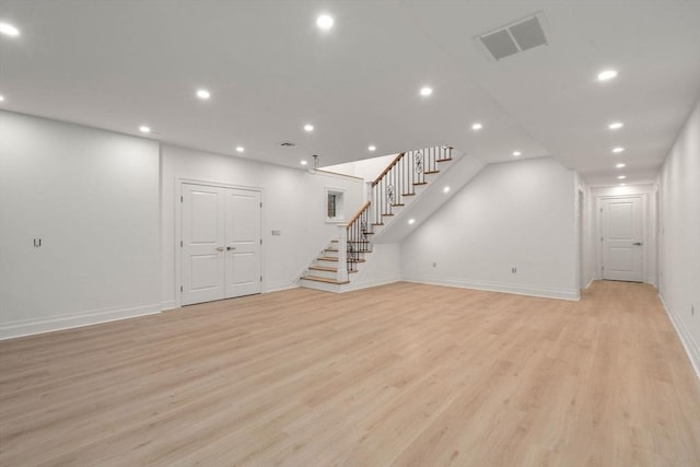 57 Mayflower Rd, Needham, MA 02492 - below grade area with stairs, light wood-style floors, recessed lighting, and baseboards