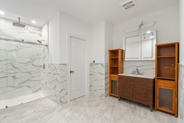 57 Mayflower Rd, Needham, MA 02492 - bathroom featuring tile walls, a marble finish shower, vanity, marble finish floors, and a wainscoted wall