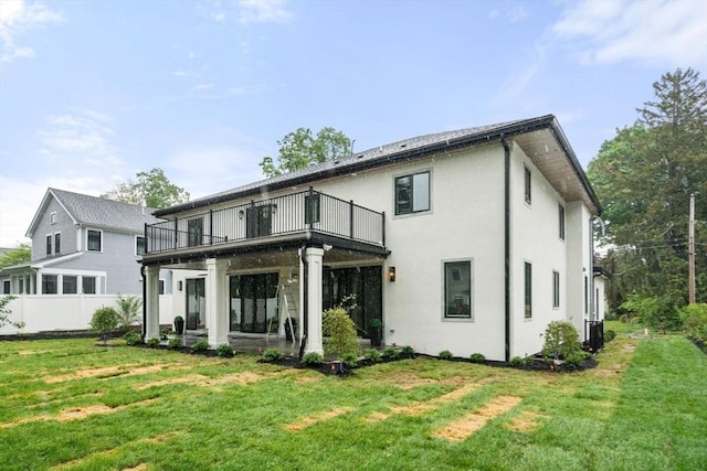 57 Mayflower Rd, Needham, MA 02492 - rear view of house with stucco siding and a patio