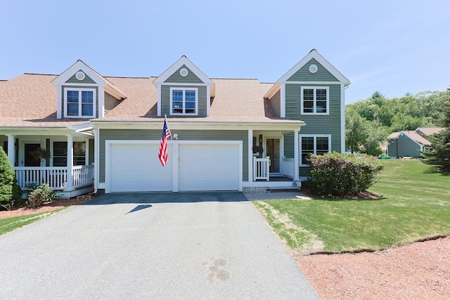 1 Washington Ct Unit 1, Uxbridge, MA 01569 - view of front facade featuring a garage, driveway, a porch, and a front lawn