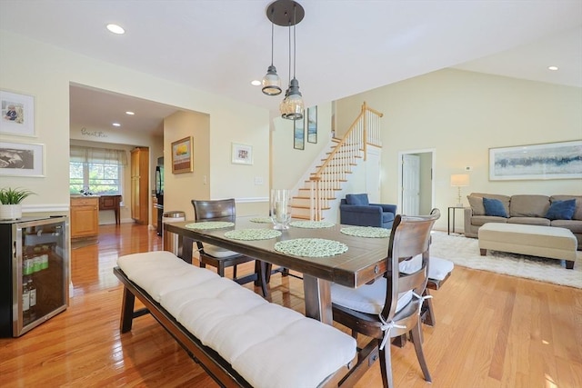 1 Washington Ct Unit 1, Uxbridge, MA 01569 - dining room with beverage cooler, stairs, light wood finished floors, recessed lighting, and lofted ceiling