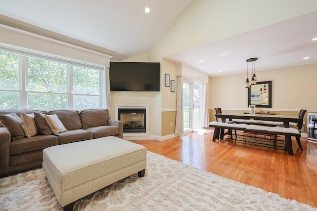 1 Washington Ct Unit 1, Uxbridge, MA 01569 - living room featuring light wood-type flooring, recessed lighting, a glass covered fireplace, vaulted ceiling, and baseboards