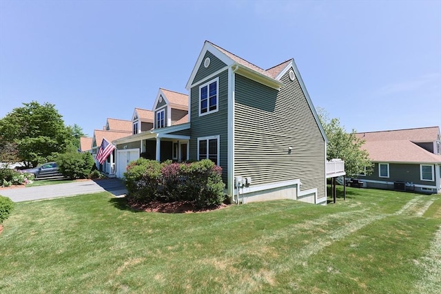 1 Washington Ct Unit 1, Uxbridge, MA 01569 - view of side of home with a yard and a garage