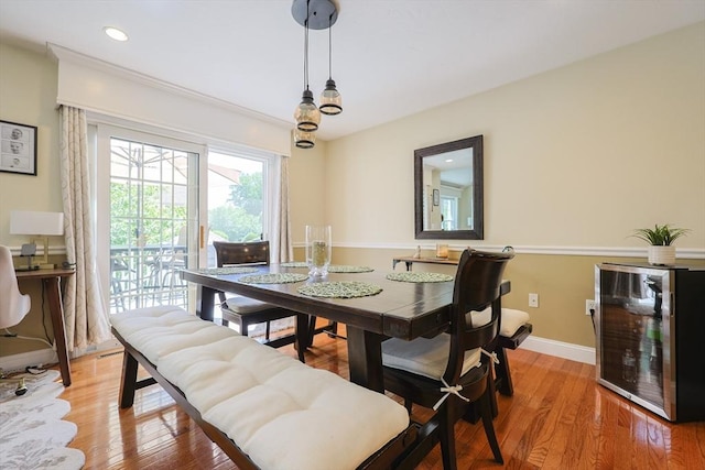 1 Washington Ct Unit 1, Uxbridge, MA 01569 - dining room with beverage cooler, baseboards, light wood-style flooring, and recessed lighting