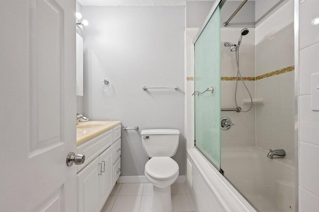 full bathroom with tile patterned flooring, vanity, toilet, and shower / bath combination with glass door