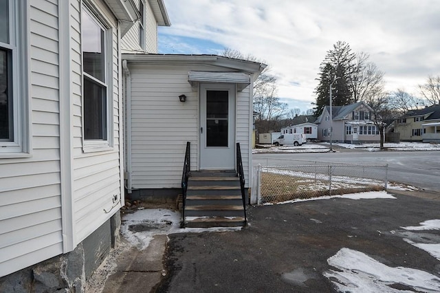 view of snow covered property entrance