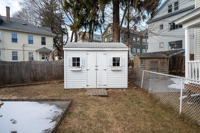 view of outbuilding with a lawn