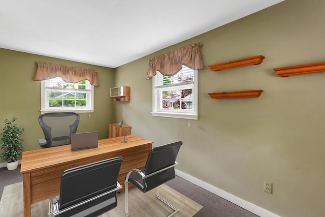 home office with baseboards and carpet floors
