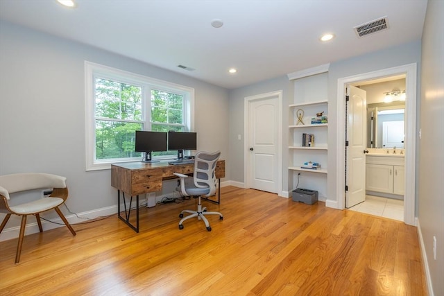 11 Liberty Ave, Burlington, MA 01803 - office featuring light wood-style floors, baseboards, recessed lighting, and a sink
