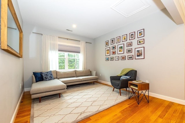 11 Liberty Ave, Burlington, MA 01803 - living area with light wood-type flooring, attic access, baseboards, and recessed lighting