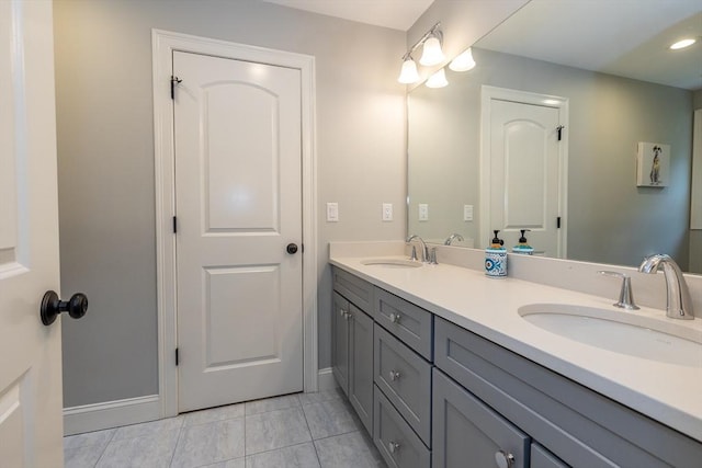 11 Liberty Ave, Burlington, MA 01803 - bathroom with double vanity, baseboards, tile patterned floors, and recessed lighting