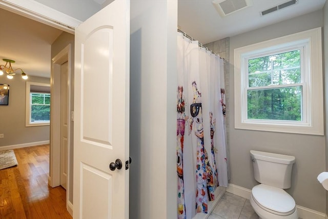 11 Liberty Ave, Burlington, MA 01803 - full bath with toilet, baseboards, a shower with shower curtain, and wood finished floors