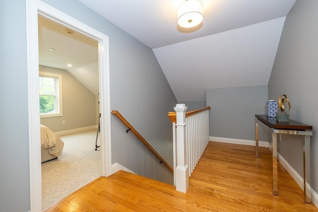 11 Liberty Ave, Burlington, MA 01803 - stairs featuring wood finished floors, vaulted ceiling, and baseboards