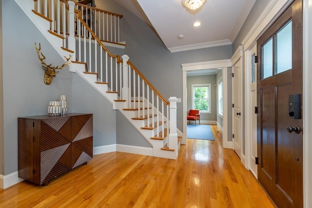 11 Liberty Ave, Burlington, MA 01803 - entrance foyer with wood finished floors, stairs, baseboards, ornamental molding, and recessed lighting