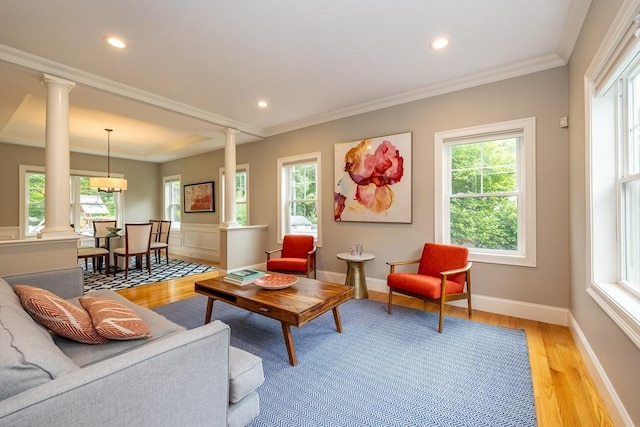 11 Liberty Ave, Burlington, MA 01803 - living room featuring decorative columns, light wood finished floors, recessed lighting, ornamental molding, and baseboards
