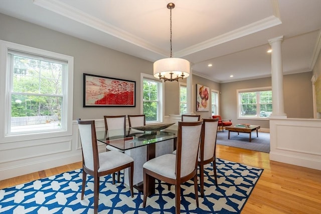 11 Liberty Ave, Burlington, MA 01803 - dining room featuring decorative columns, crown molding, light wood-style floors, wainscoting, and a raised ceiling