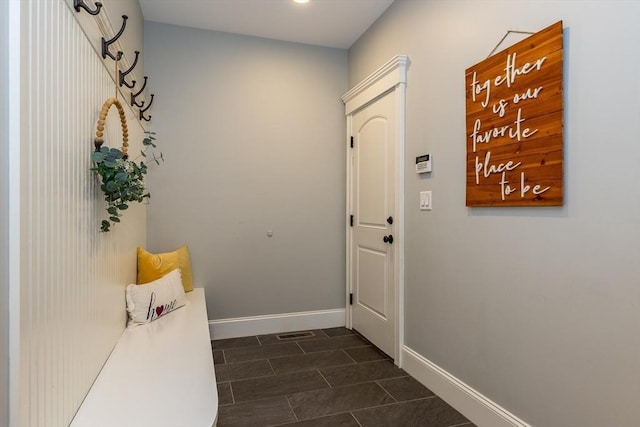 11 Liberty Ave, Burlington, MA 01803 - doorway featuring baseboards, dark tile patterned flooring, and recessed lighting