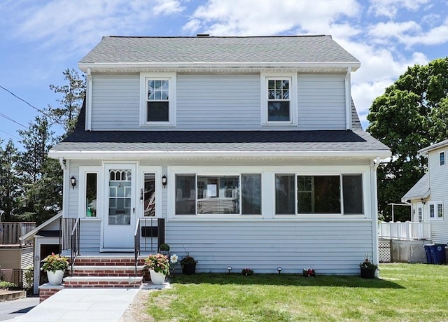 21 Trefton Dr, Braintree, MA 02184 - view of front of house featuring a front yard and a shingled roof