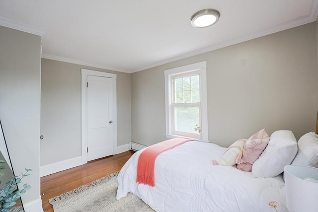 21 Trefton Dr, Braintree, MA 02184 - bedroom with a baseboard heating unit, wood finished floors, baseboards, and ornamental molding