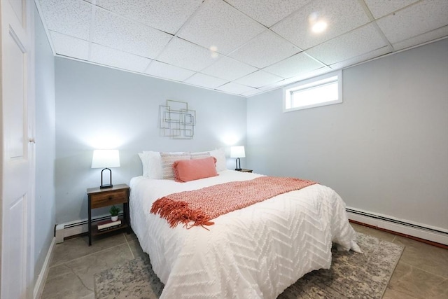 21 Trefton Dr, Braintree, MA 02184 - tiled bedroom with baseboard heating, a paneled ceiling, and baseboards