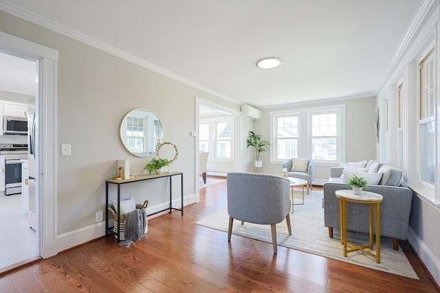21 Trefton Dr, Braintree, MA 02184 - living area featuring a wall unit AC, crown molding, wood finished floors, and baseboards
